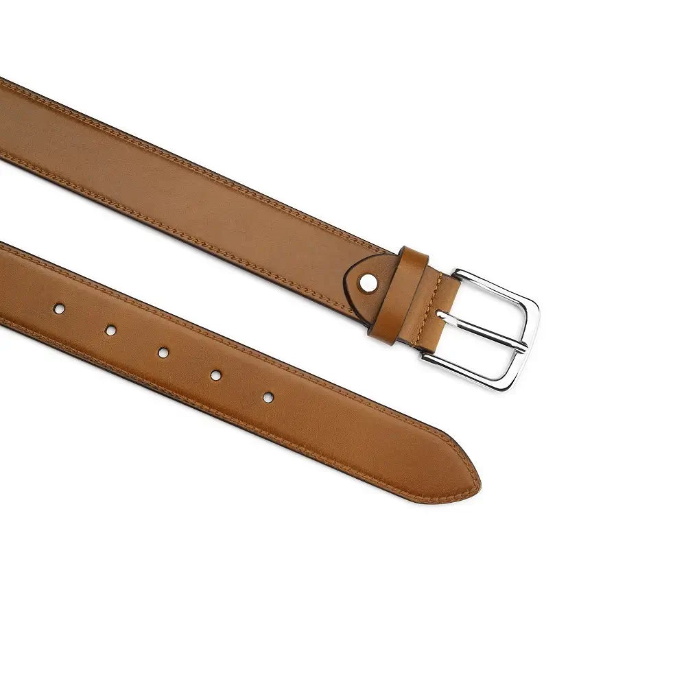 Top angle of Tan leather belt with a silver buckle on a white background