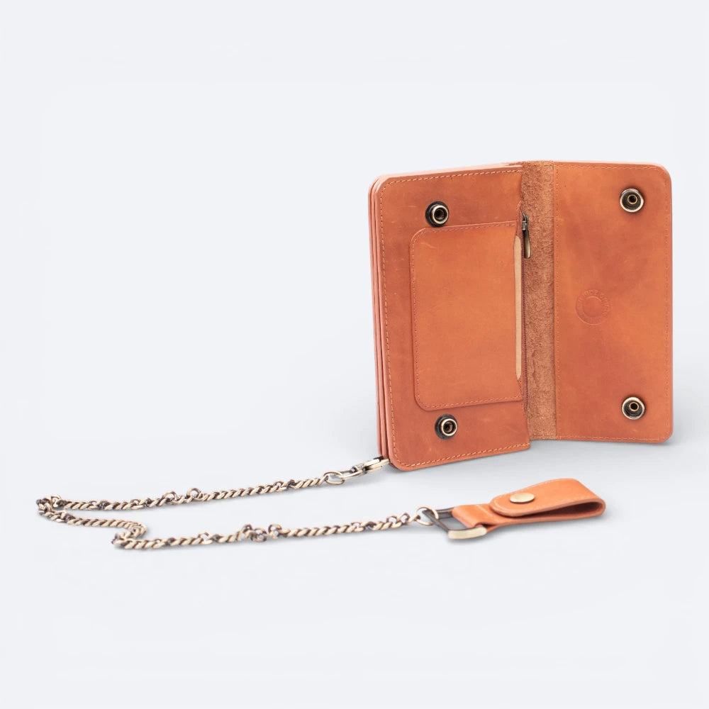 Tan leather wallet with chain on a light gray background