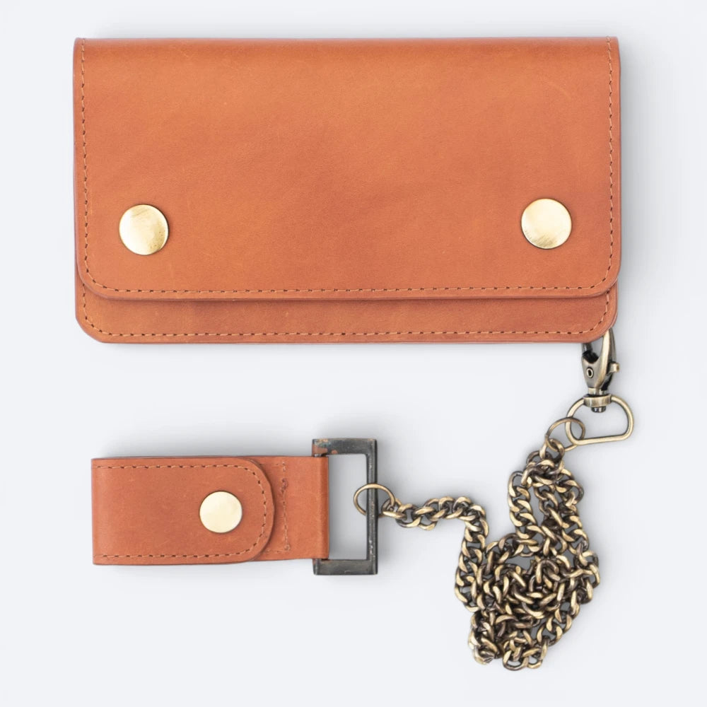 Tan leather wallet with chain strap on a white background