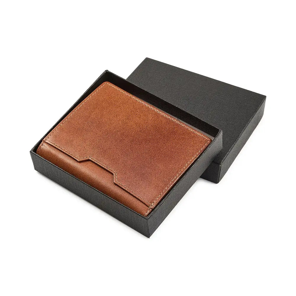 Tan leather wallet in a black box on a white background