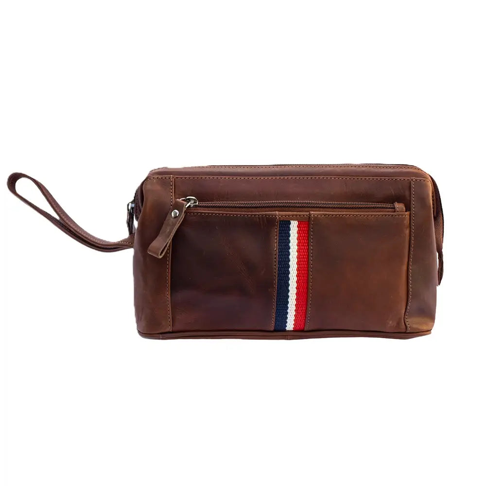A cognac wash bag with a front zippered pocket featuring a vertical red, white, and navy blue stripe detail, shown on a plain white background.