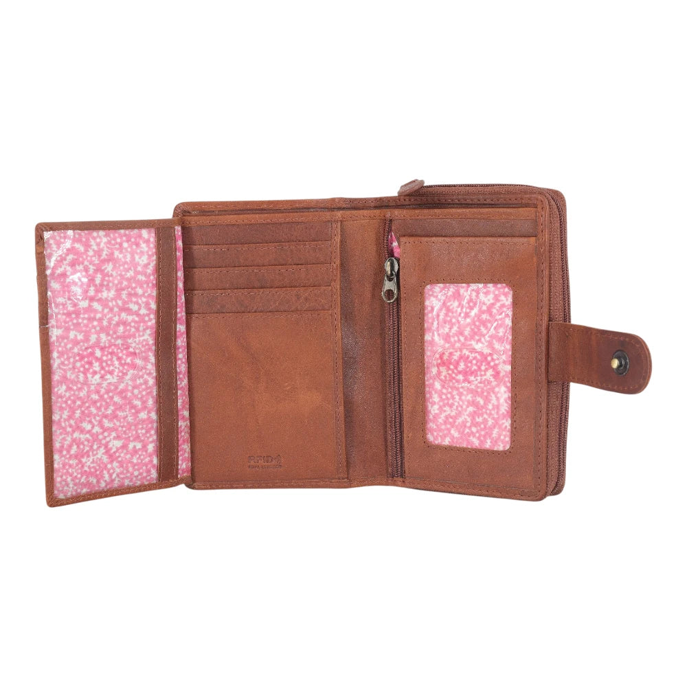 Open view of Cognac  leather wallet with pink interior on a white background