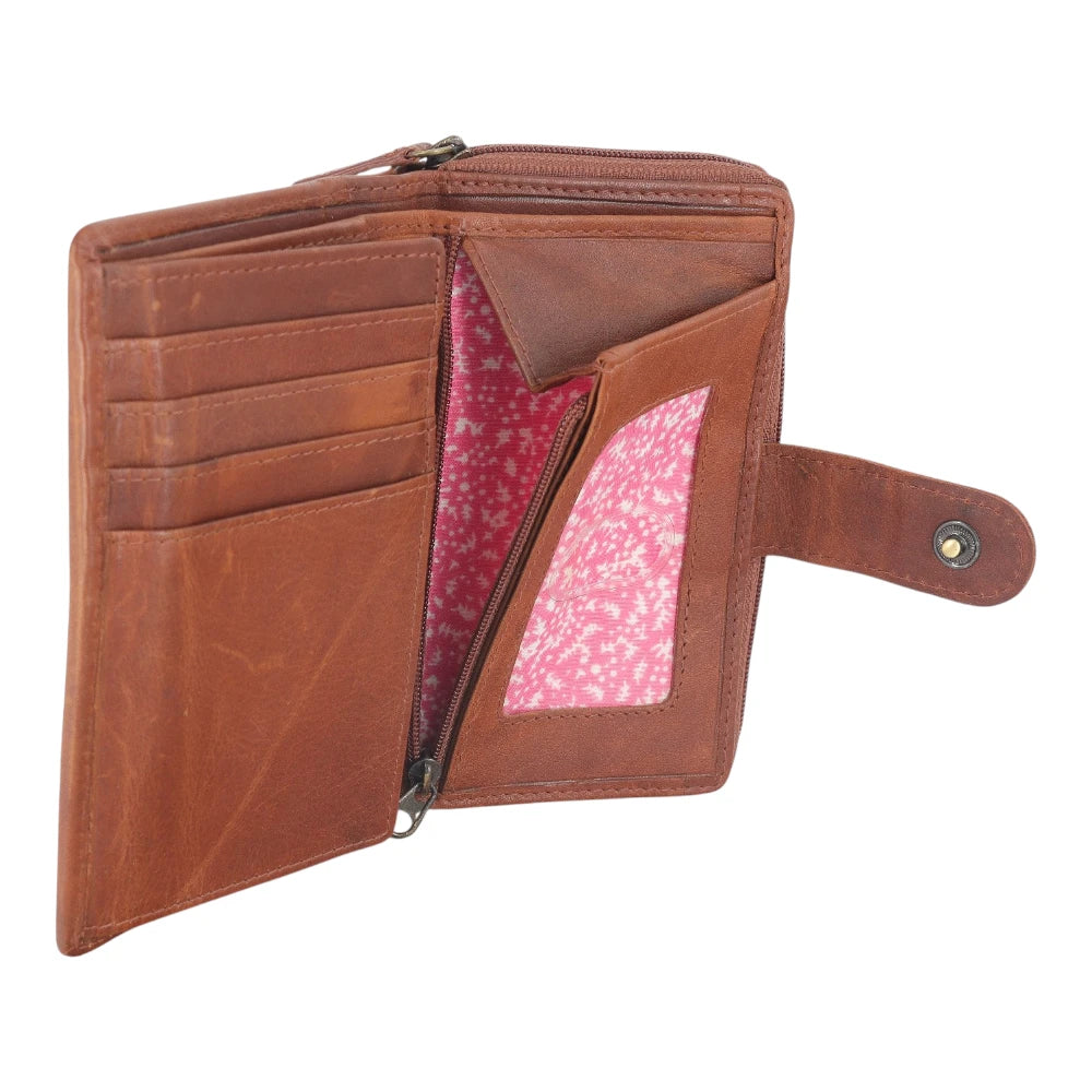 Inside view of Cognac  leather wallet with pink interior on a white background