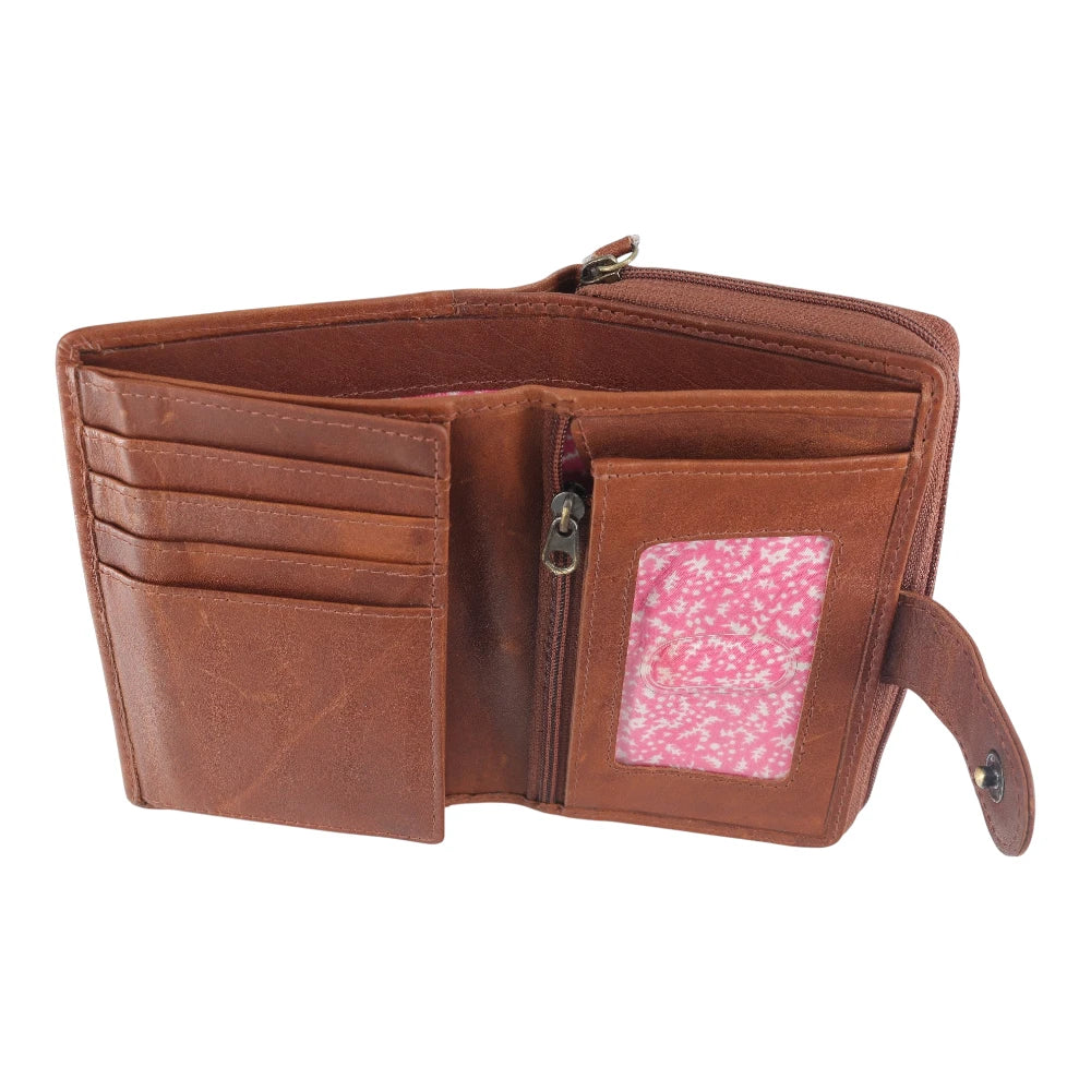 Cognac leather wallet with a pink polka dot pocket on a white background
