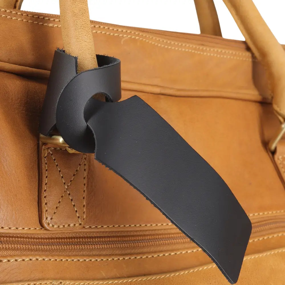 Front view of Black loop style luggage tag