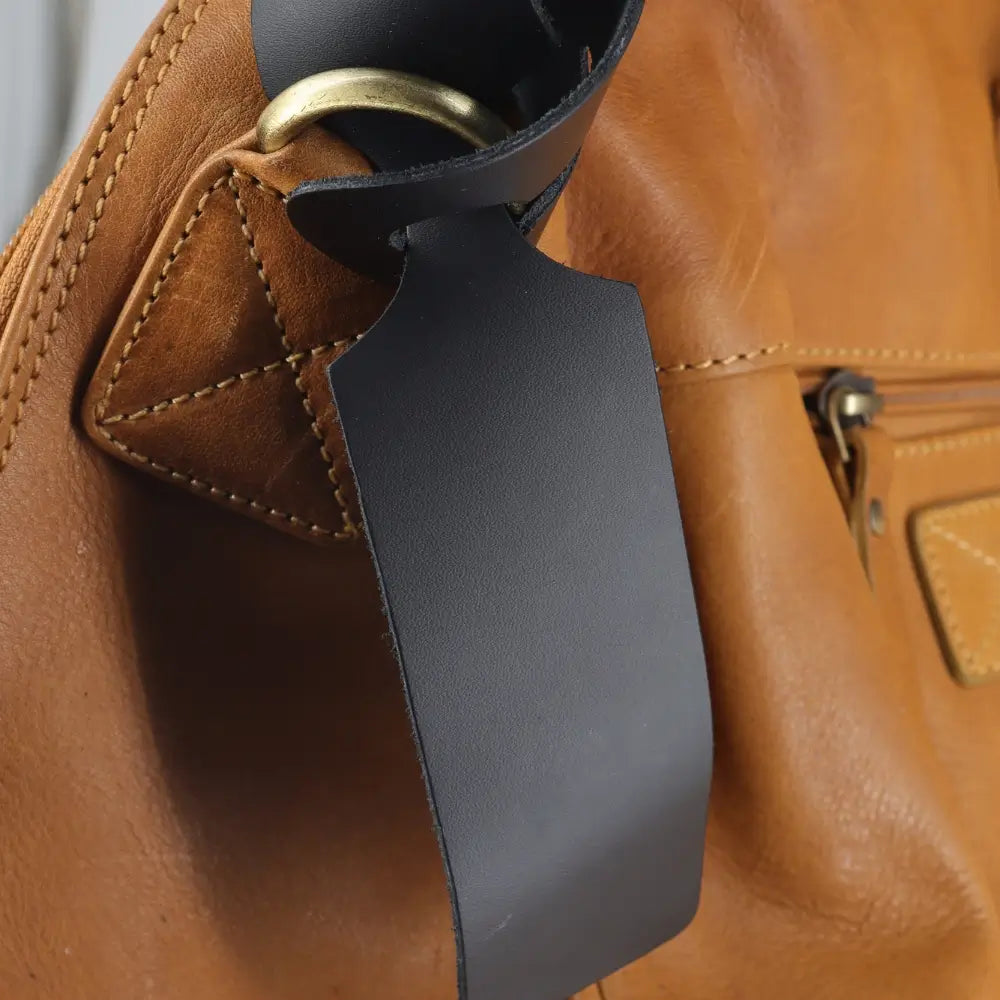 Front view of Black loop style luggage tag
