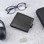Flat lay of Basic Wallet Style 66 on a table, styled with everyday essentials.