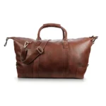 Front view of the Vintage Holdall Ridgeback 670 in rich brown genuine leather, showing sturdy top handles and an adjustable shoulder strap.
