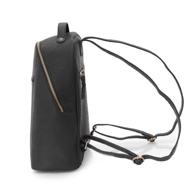 side view of a black leather backpack. A zip to the back of can be seen. The bag has adjustable leather straps.