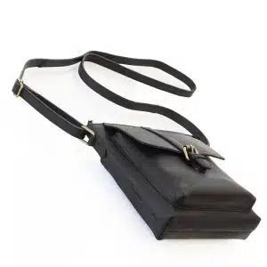 black leather crossbody bag with front buckle.