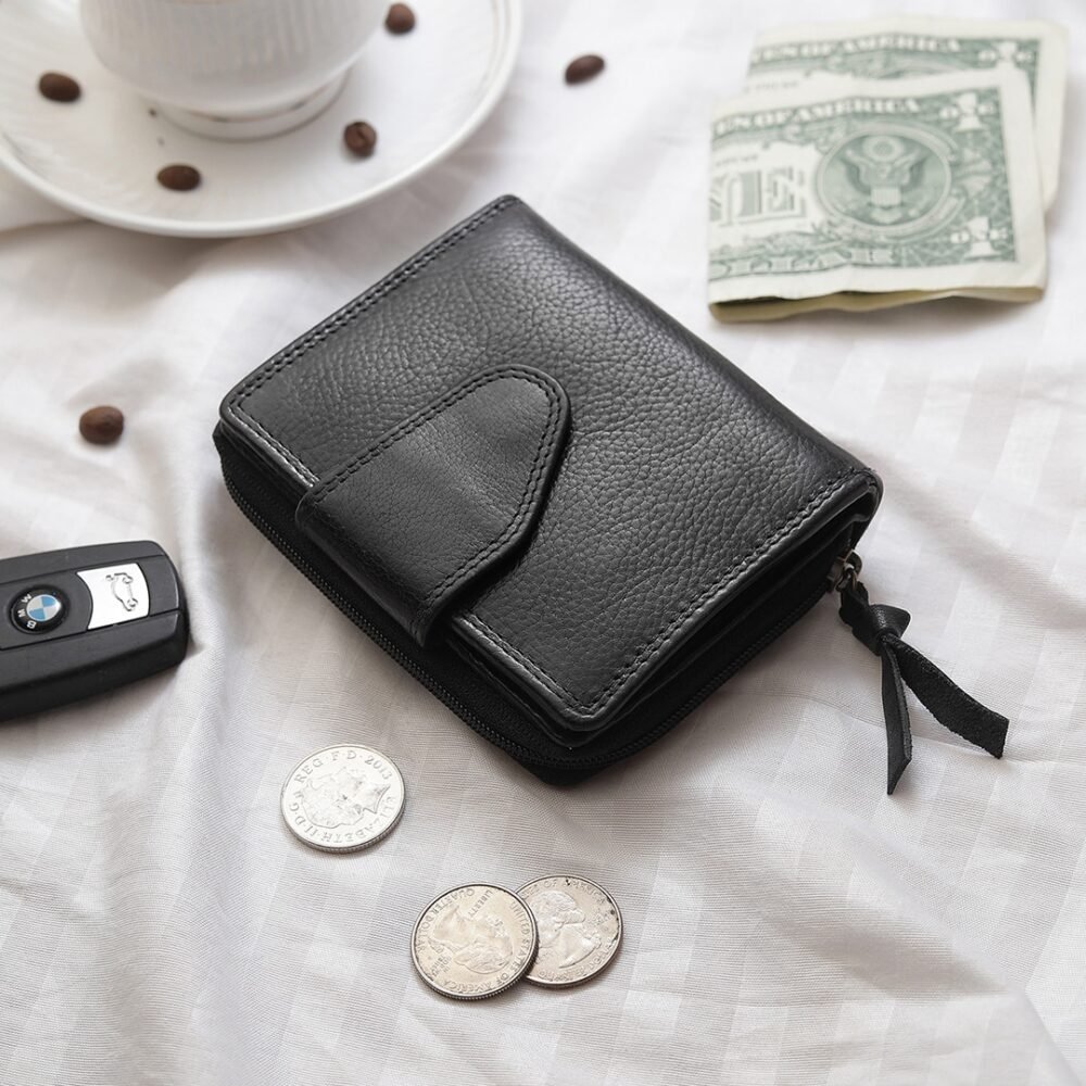 Small Leather Trifold Purse in Black by PRIMEHDE Trade, a great addition to your retail collection.