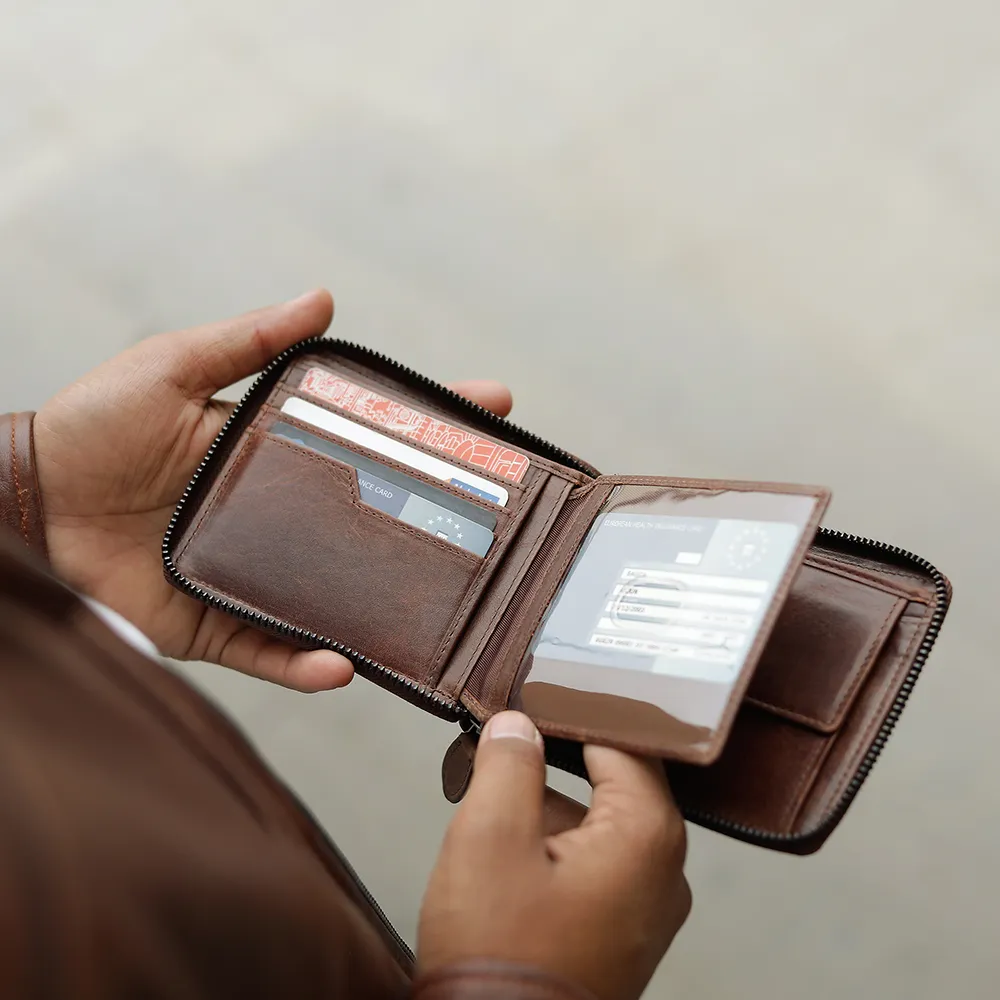 brown zip-around wallet - Alperto 4257. Close-up of ID window, card slots, and coin pocket inside the wallet