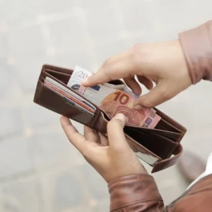 Man holding brown trifold leather cardholder wallet - Alperto 4269. RFID secure and crafted from oiled leather.