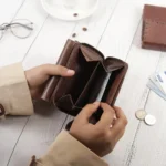 Close-up of the Medium brown Trifold Purse's rear zipped coin pouch, highlighting practical design for secure coin storage.