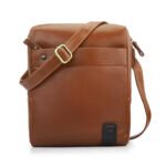 Chestnut leather messenger bag with clean design and adjustable strap, part of the Tuscan collection.