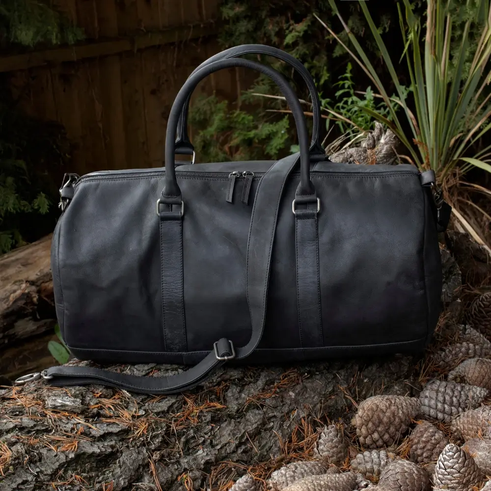 Outdoor display view of the Columbus Black Leather Holdall showcasing its premium leather texture and modern travel style.