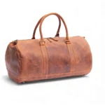 Side view of the Hunter Leather Holdall in Vintage Tan with detachable, adjustable shoulder strap.