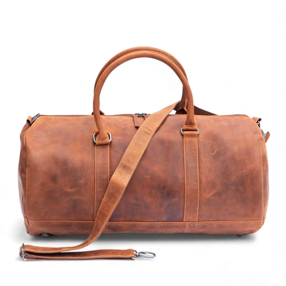 Front view of the Hunter Leather Holdall in Vintage Tan showing the classic duffel shape and front zipped pocket.